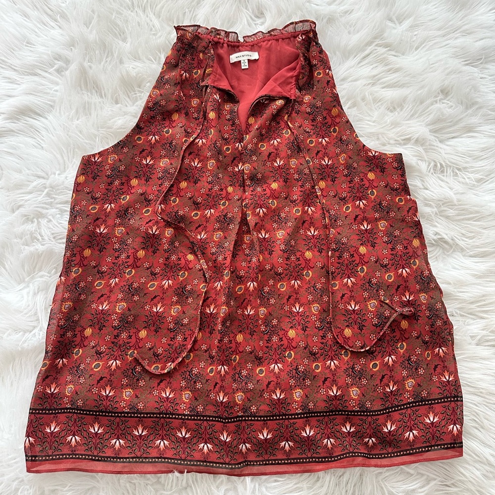 Red orange floral sleeveless blouse with adjustable neck ruffle